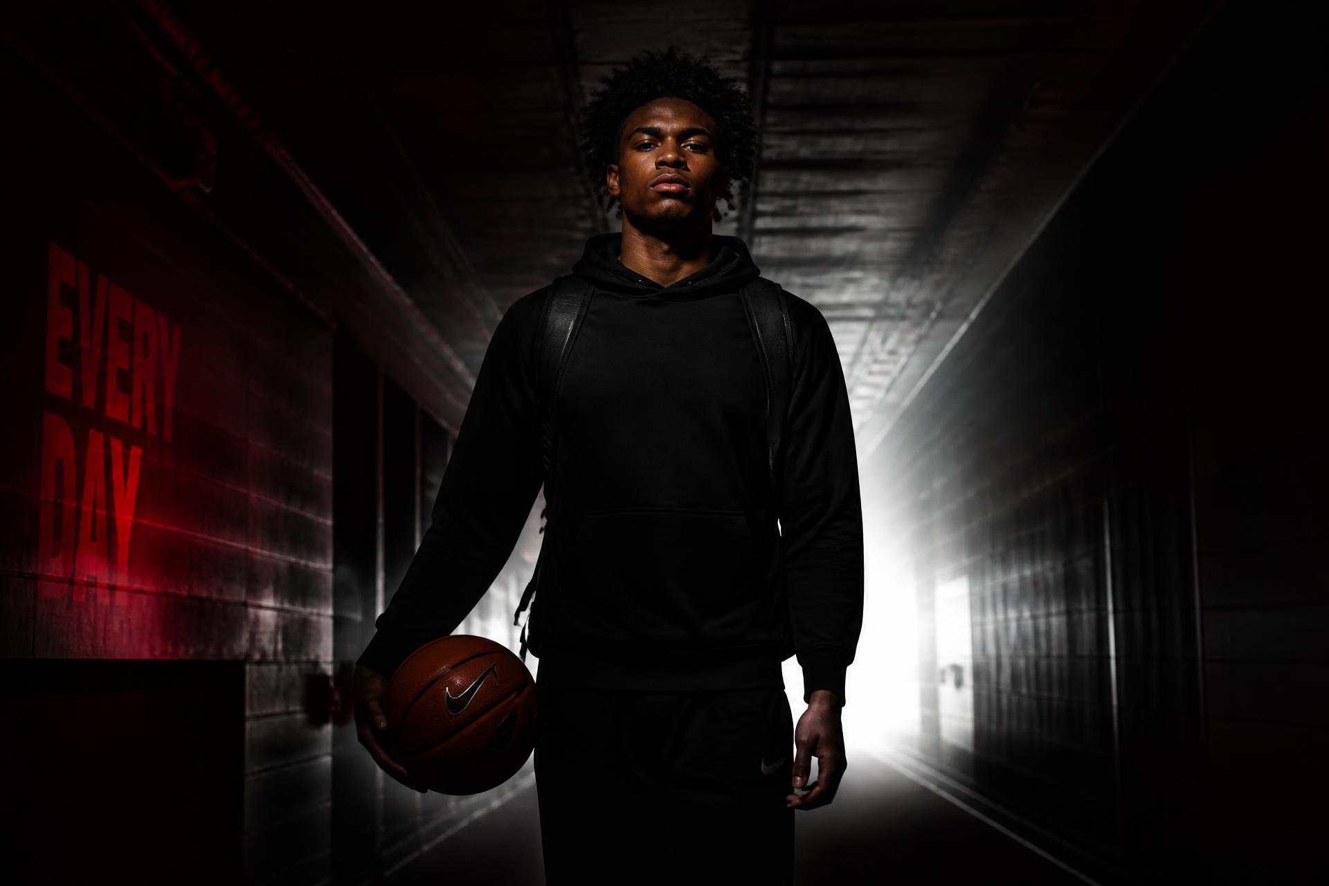 College student-athlete standing in a stadium tunnel